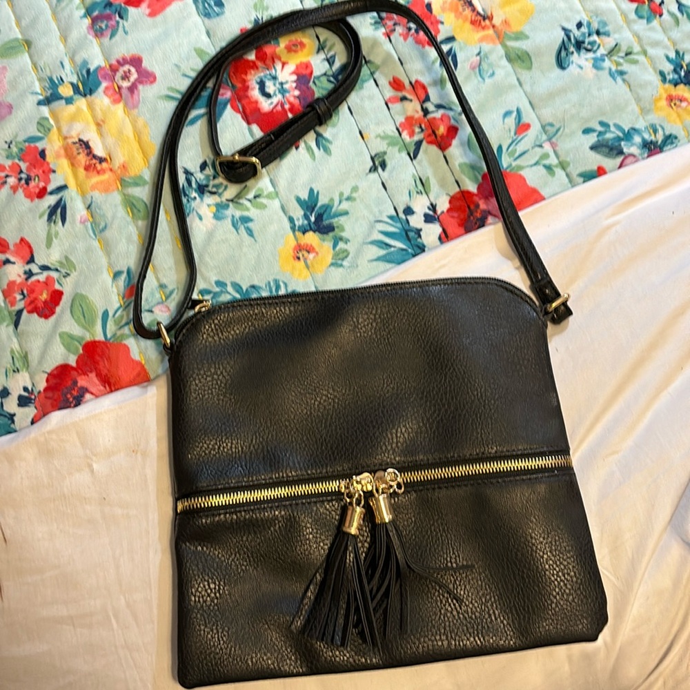 Black faux leather cross body with front zipper pocket